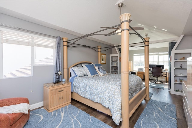 bedroom with ceiling fan, dark hardwood / wood-style flooring, and vaulted ceiling