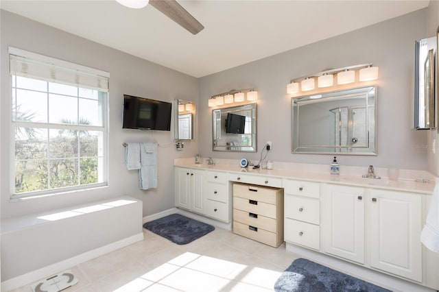 bathroom with ceiling fan, tile patterned flooring, and vanity