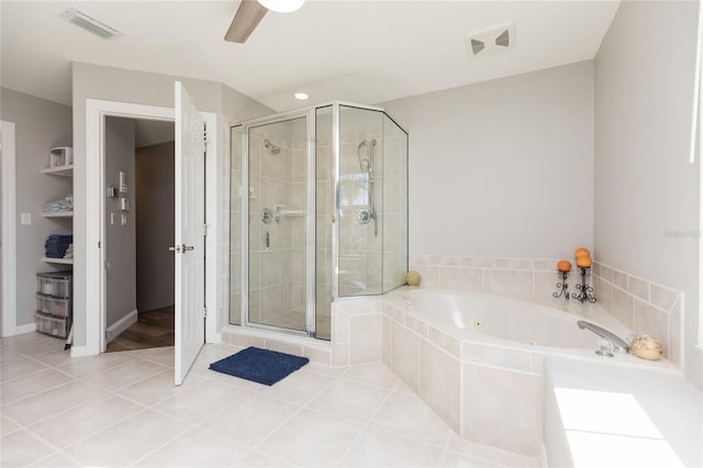 bathroom with tile patterned flooring and independent shower and bath