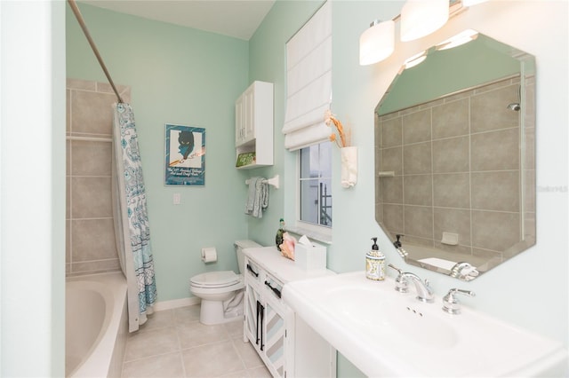 full bathroom featuring tile patterned flooring, toilet, sink, and shower / tub combo with curtain