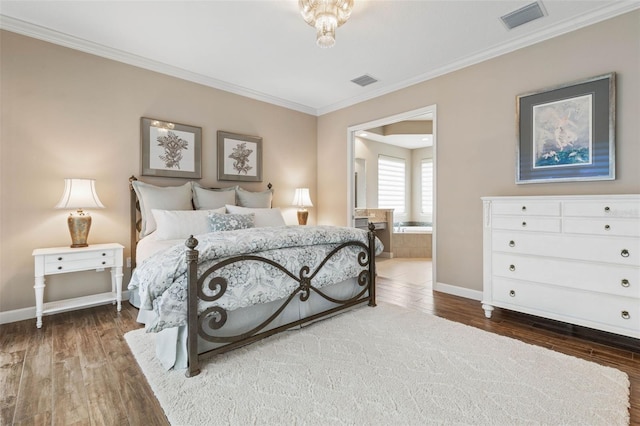 bedroom with ensuite bathroom, dark hardwood / wood-style floors, and ornamental molding