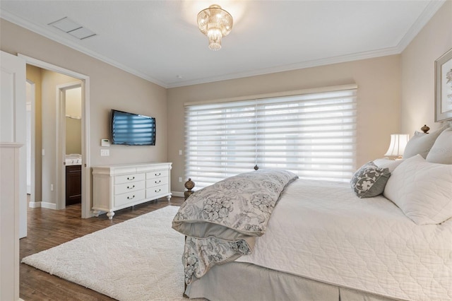 bedroom with connected bathroom, crown molding, and dark hardwood / wood-style flooring