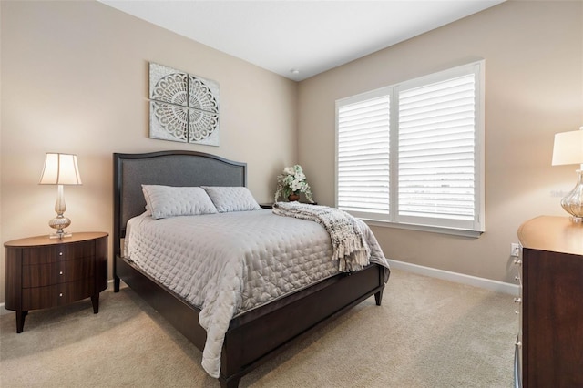 carpeted bedroom featuring multiple windows