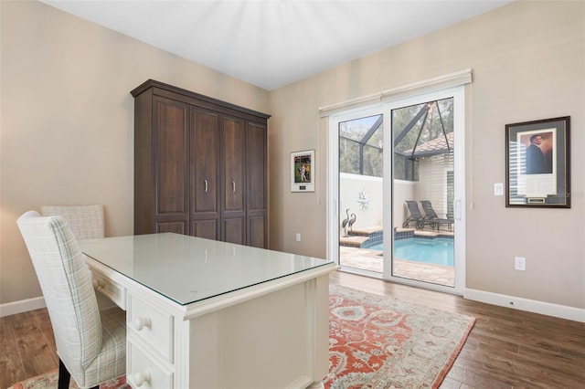 home office with hardwood / wood-style floors