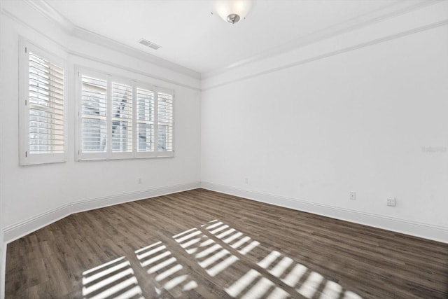 unfurnished room with crown molding and dark wood-type flooring