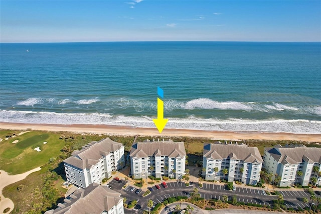 drone / aerial view with a view of the beach and a water view