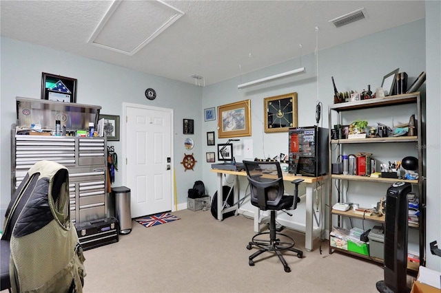 office space featuring carpet flooring and a textured ceiling