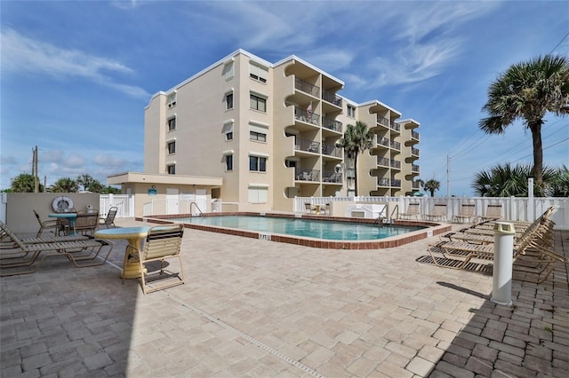 view of pool featuring a patio