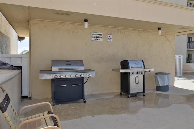 view of patio featuring a grill