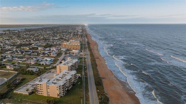 bird's eye view featuring a water view and a view of the beach