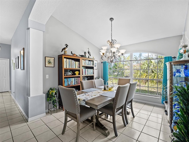 tiled dining area featuring lofted ceiling and a notable chandelier