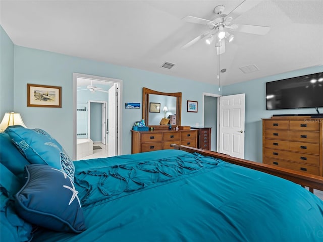 bedroom featuring ceiling fan, lofted ceiling, and connected bathroom