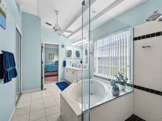 bathroom featuring tile patterned floors, vanity, and shower with separate bathtub