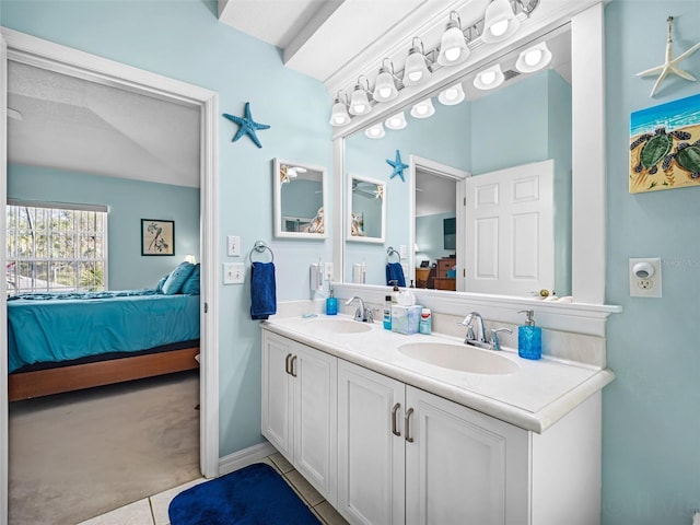 bathroom with tile patterned flooring and vanity