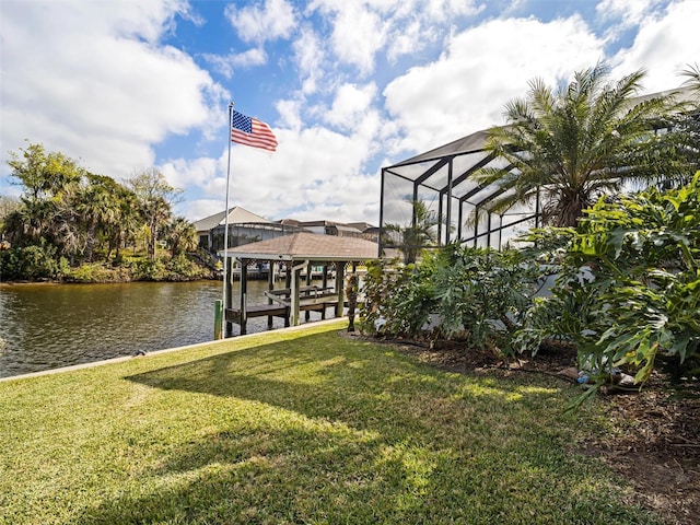 view of dock with a water view, a lanai, and a lawn