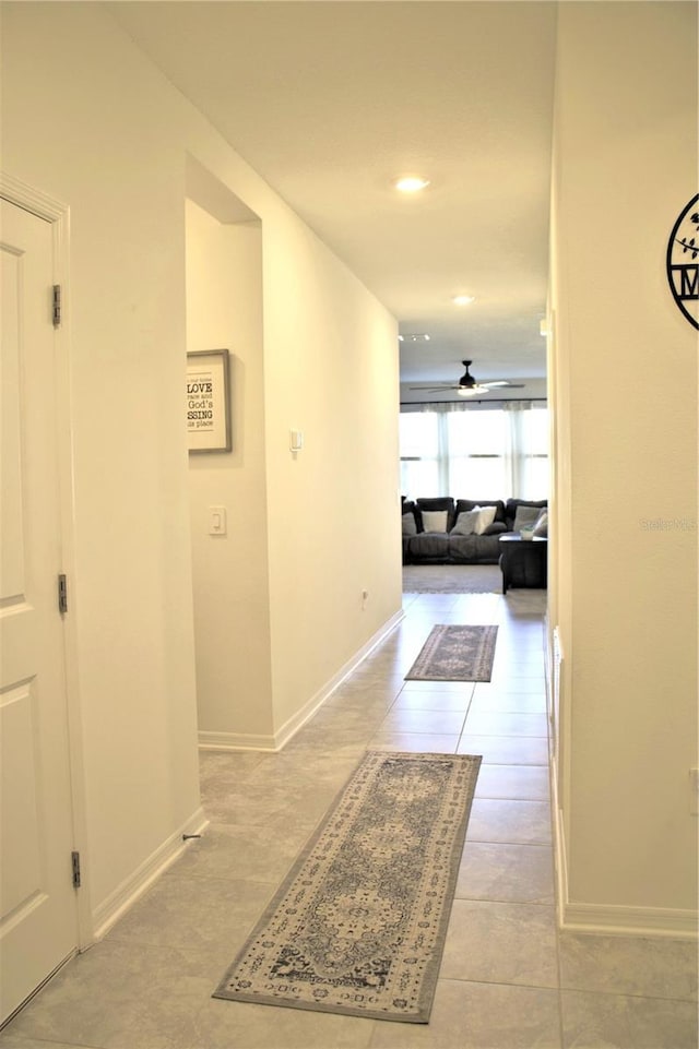 hallway featuring light tile patterned flooring