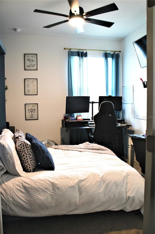 bedroom featuring ceiling fan and carpet floors