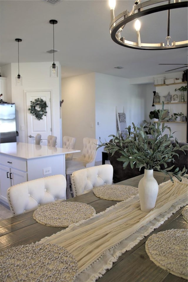 dining space with hardwood / wood-style flooring