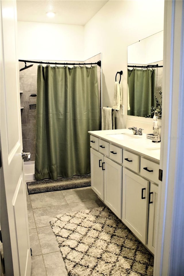 bathroom with vanity and a shower with shower curtain