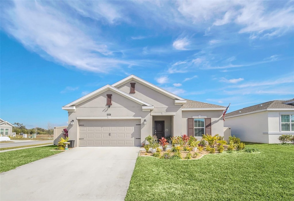 4247 Little Owl Ln, Kissimmee, FL 34746 - ranch-style home featuring a garage and a front lawn
