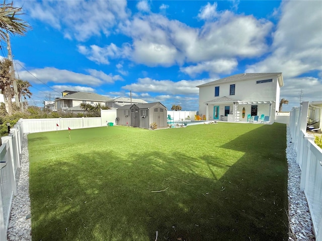 view of yard featuring a storage unit and a pergola