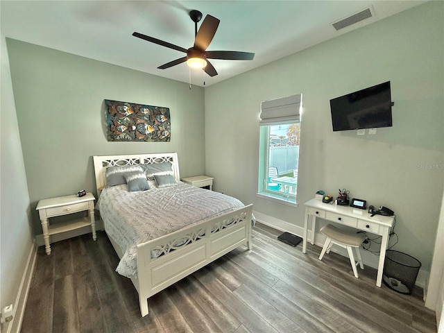 bedroom with ceiling fan and dark hardwood / wood-style floors