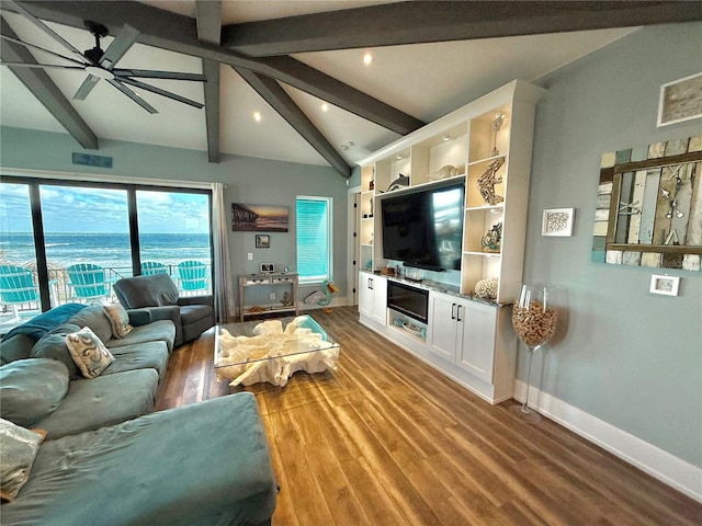 living room with vaulted ceiling with beams, ceiling fan, a water view, and hardwood / wood-style flooring