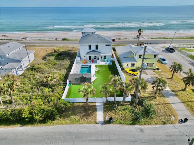 aerial view featuring a water view and a view of the beach