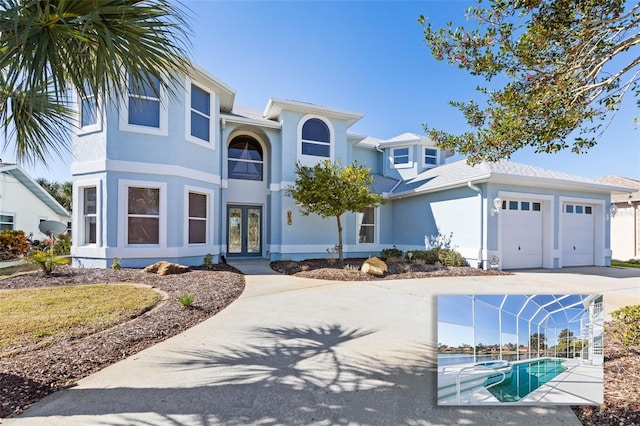 view of front facade featuring french doors and a garage