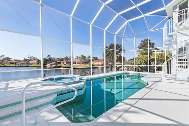 view of swimming pool with a lanai, a water view, a jacuzzi, and a patio