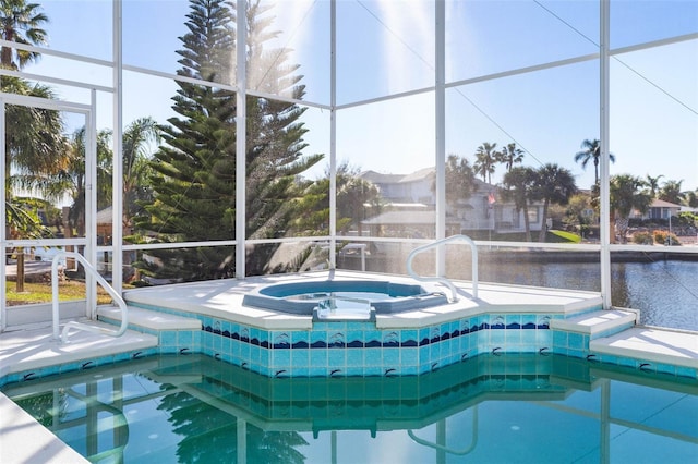 view of swimming pool with a lanai, a water view, and an in ground hot tub