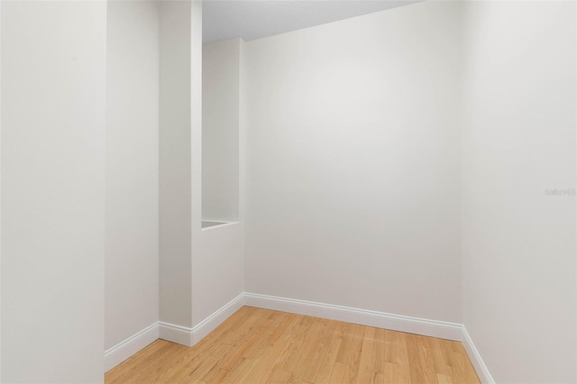 unfurnished room with light hardwood / wood-style floors