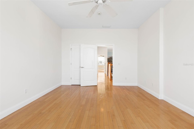 spare room with ceiling fan and light hardwood / wood-style floors