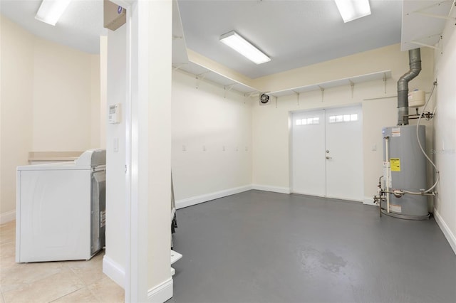 basement featuring water heater and washer and clothes dryer