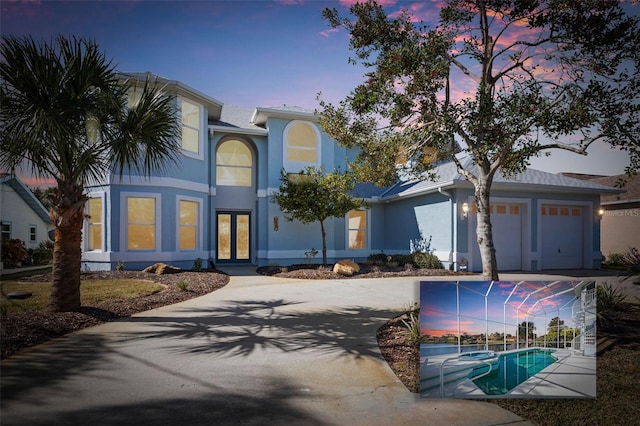 view of front of home featuring a garage and french doors