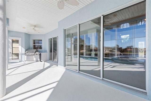 view of patio / terrace featuring ceiling fan