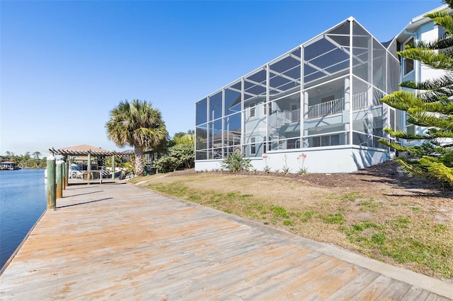 dock area featuring a pergola and a water view