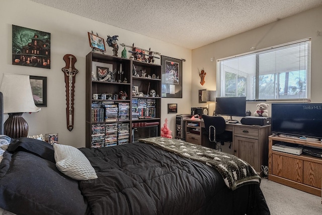 bedroom with light colored carpet and a textured ceiling