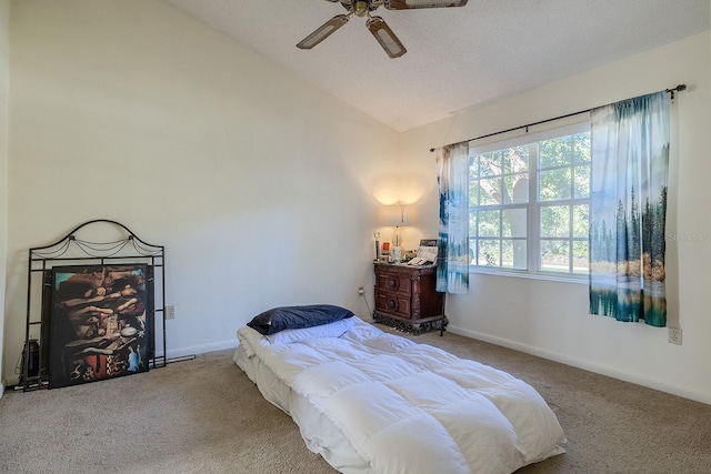 carpeted bedroom featuring ceiling fan and vaulted ceiling