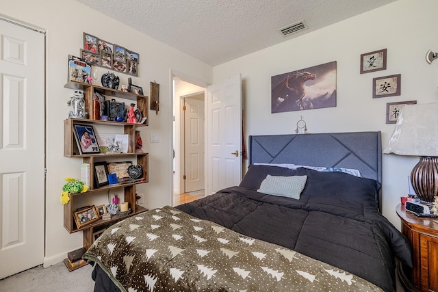 carpeted bedroom with a textured ceiling