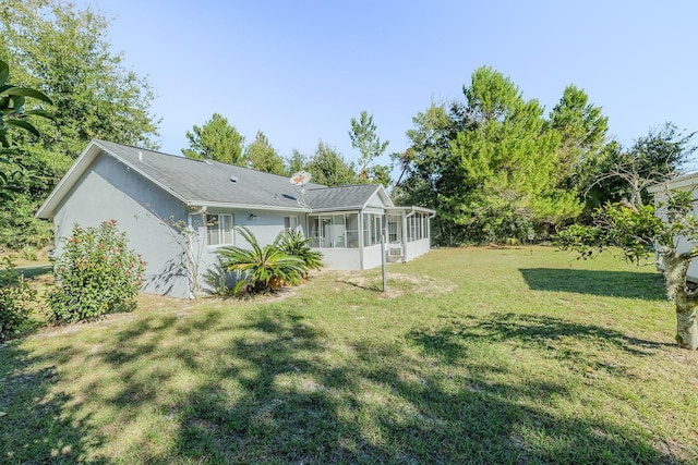 view of yard with a sunroom and cooling unit