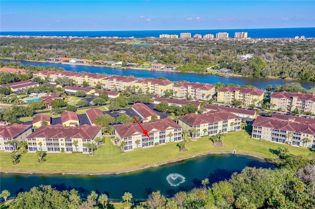 birds eye view of property featuring a water view