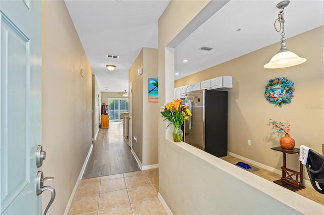 hallway with light tile patterned flooring