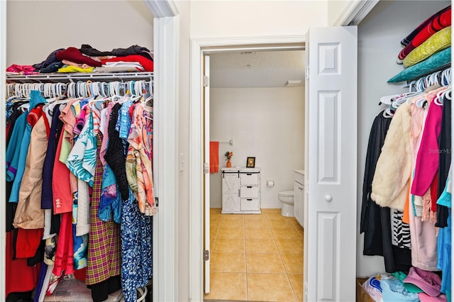 walk in closet featuring light tile patterned floors