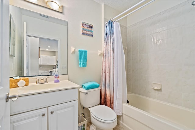 full bathroom with shower / bath combination with curtain, vanity, a textured ceiling, and toilet