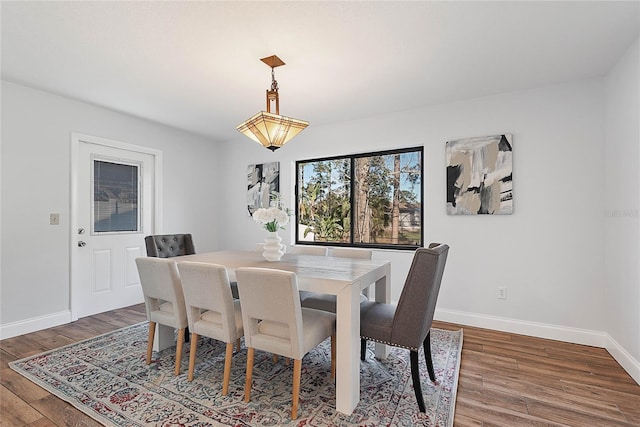 dining area featuring dark hardwood / wood-style floors