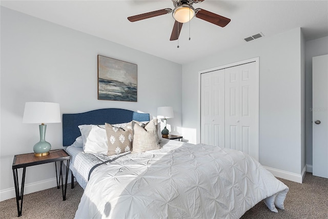 carpeted bedroom with a closet and ceiling fan