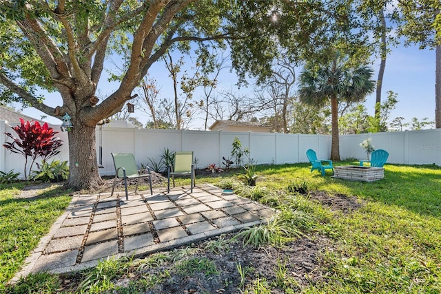 view of yard with a patio and a fire pit