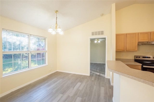 kitchen with light brown cabinets, pendant lighting, stainless steel electric stove, ceiling fan with notable chandelier, and light wood-type flooring