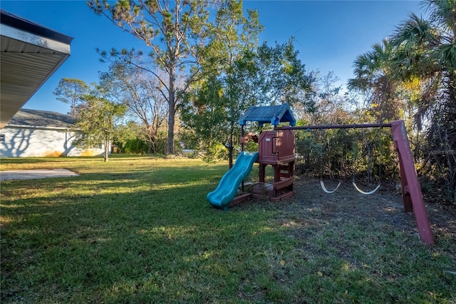 view of playground with a lawn